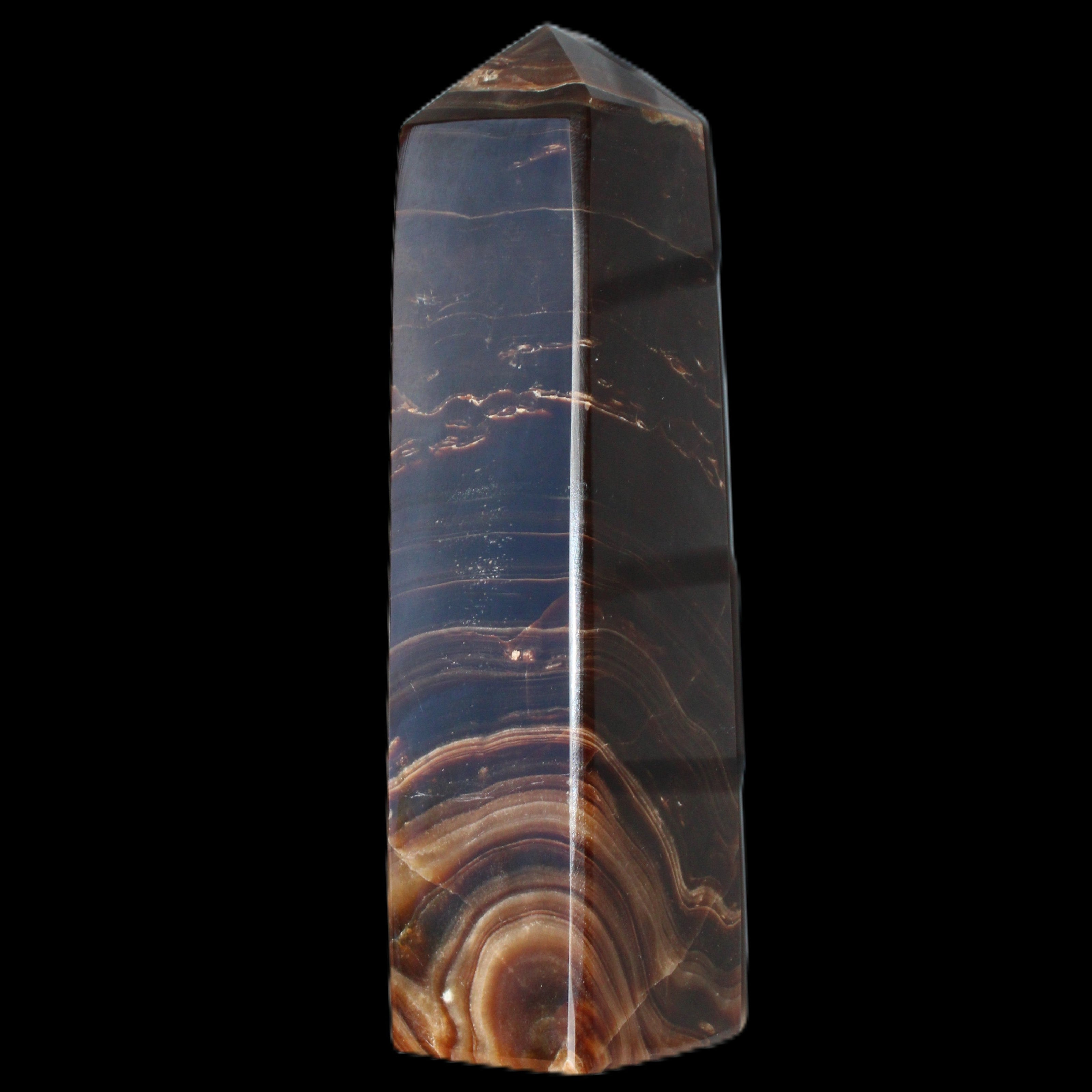 Chocolate Calcite obelisk 136*36mm 366g in sunlight - Rocks and Things Store