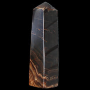 Chocolate Calcite obelisk 136*36mm 366g in sunlight - Rocks and Things Store