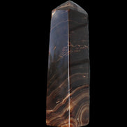 Chocolate Calcite obelisk 136*36mm 366g in sunlight - Rocks and Things Store