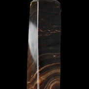 Chocolate Calcite obelisk 136*36mm 366g in sunlight - Rocks and Things Store