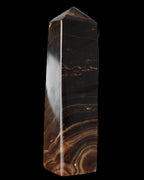 Chocolate Calcite obelisk 136*36mm 366g in sunlight - Rocks and Things Store