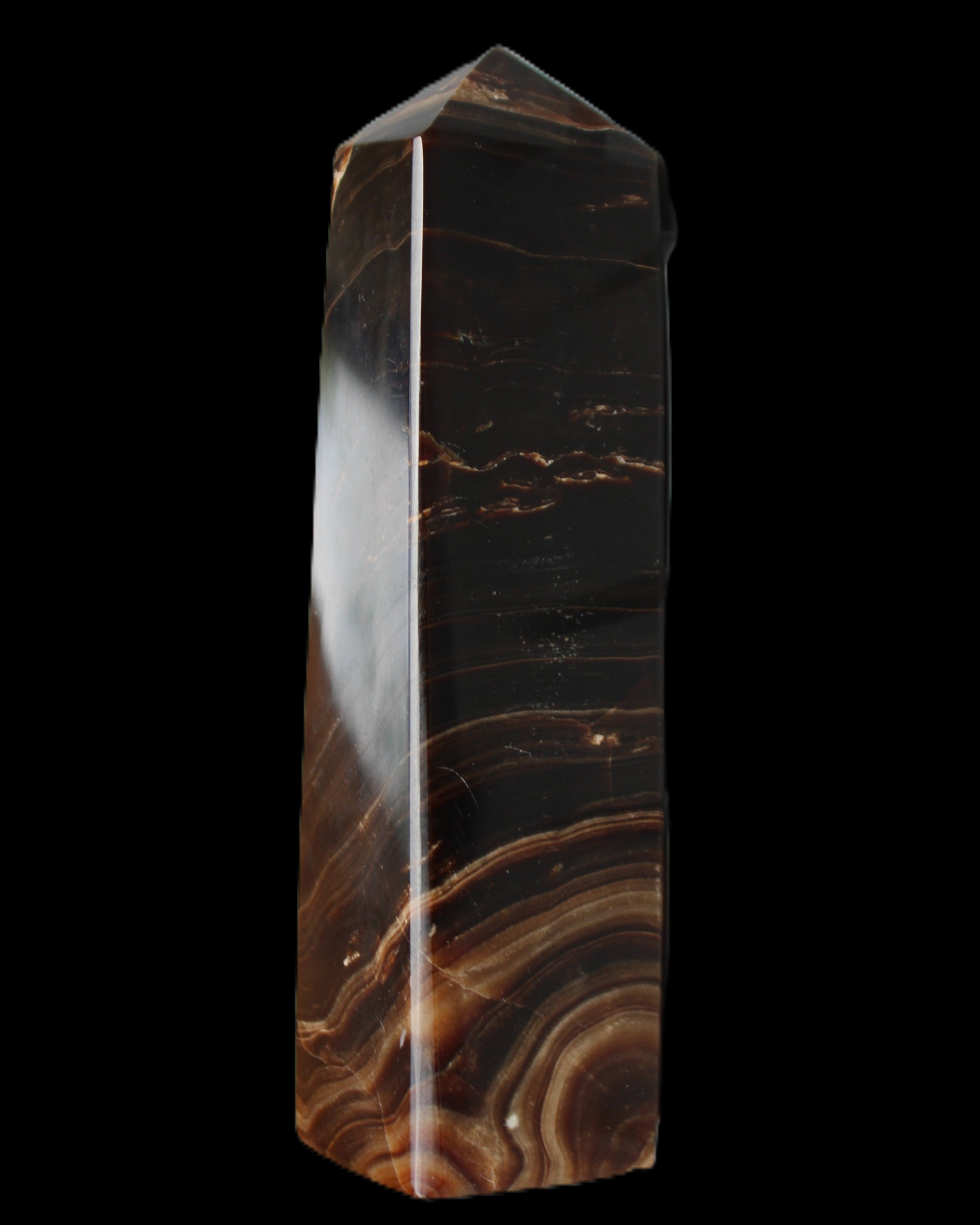 Chocolate Calcite obelisk 136*36mm 366g in sunlight - Rocks and Things Store