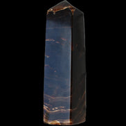Chocolate Calcite obelisk 136*36mm 366g in sunlight - Rocks and Things Store