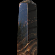 Chocolate Calcite obelisk 136*36mm 366g in sunlight - Rocks and Things Store