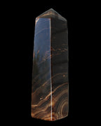 Chocolate Calcite obelisk 136*36mm 366g in sunlight - Rocks and Things Store