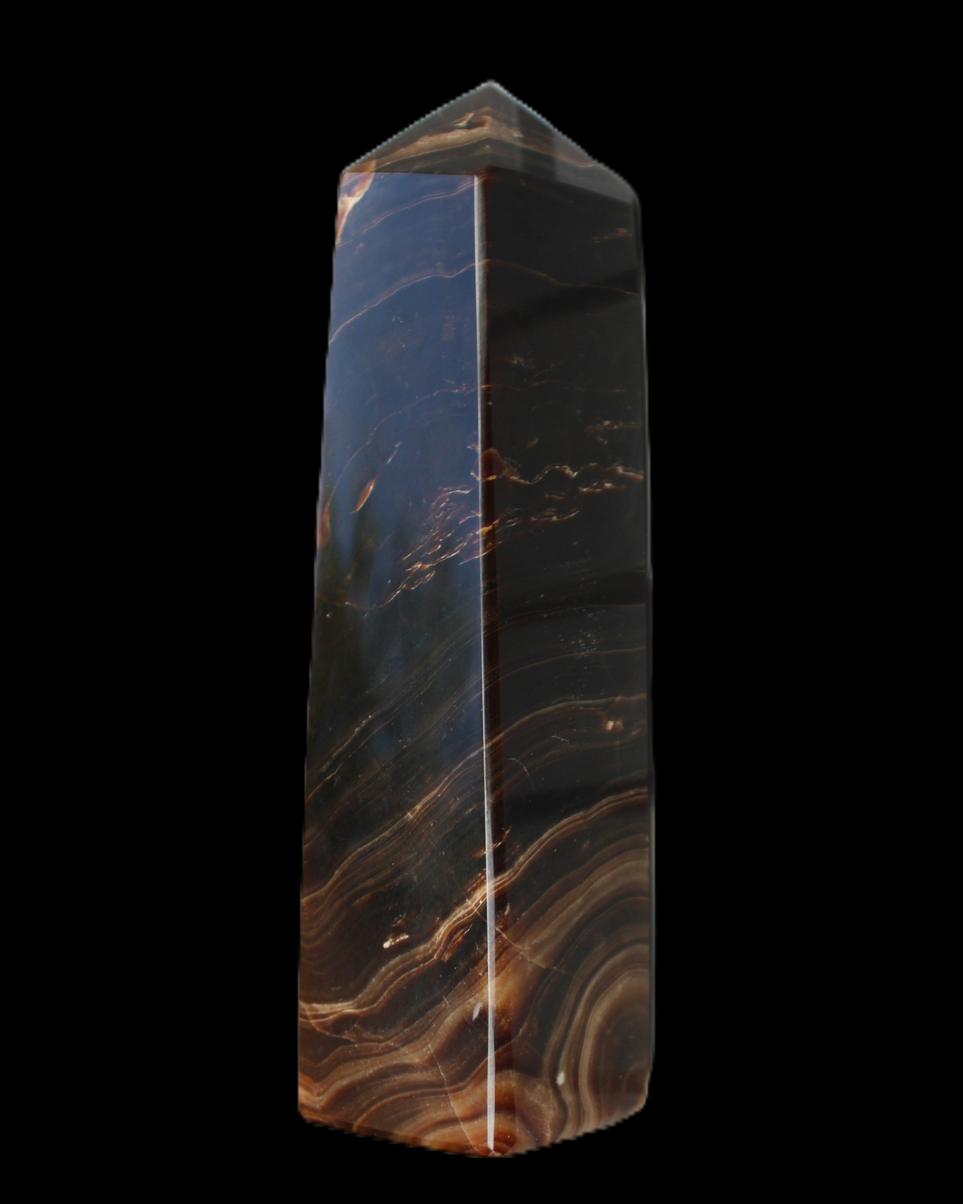 Chocolate Calcite obelisk 136*36mm 366g in sunlight - Rocks and Things Store