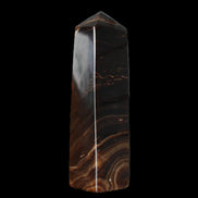 Chocolate Calcite obelisk 136*36mm 366g in sunlight - Rocks and Things Store
