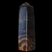 Chocolate Calcite obelisk 136*36mm 366g in sunlight - Rocks and Things Store