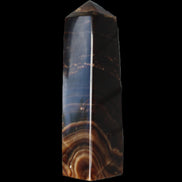 Chocolate Calcite obelisk 136*36mm 366g in sunlight - Rocks and Things Store