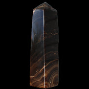 Chocolate Calcite obelisk 136*36mm 366g in sunlight - Rocks and Things Store