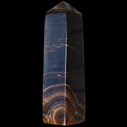 Chocolate Calcite obelisk 136*36mm 366g in sunlight - Rocks and Things Store