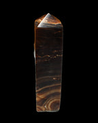 Chocolate Calcite obelisk 136*36mm 366g in sunlight - Rocks and Things Store