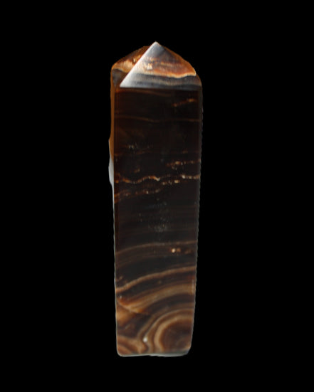Chocolate Calcite obelisk 136*36mm 366g in sunlight - Rocks and Things Store