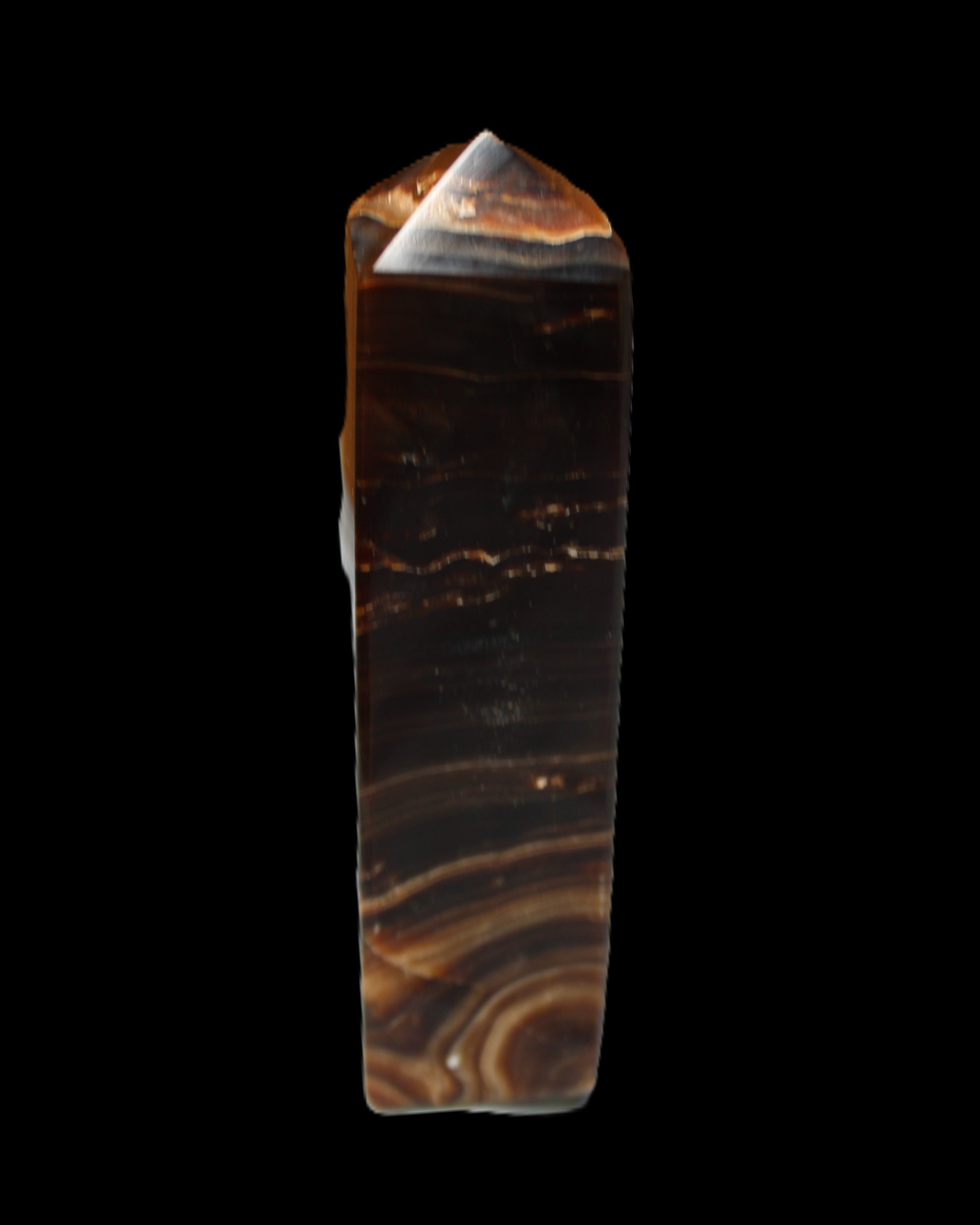 Chocolate Calcite obelisk 136*36mm 366g in sunlight - Rocks and Things Store