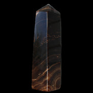 Chocolate Calcite obelisk 136*36mm 366g in sunlight - Rocks and Things Store