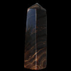 Chocolate Calcite obelisk 136*36mm 366g in sunlight - Rocks and Things Store