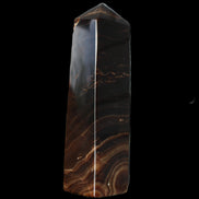 Chocolate Calcite obelisk 136*36mm 366g in sunlight - Rocks and Things Store