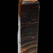 Chocolate Calcite obelisk 136*36mm 366g in sunlight - Rocks and Things Store
