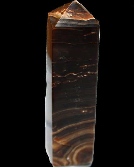 Chocolate Calcite obelisk 136*36mm 366g in sunlight - Rocks and Things Store