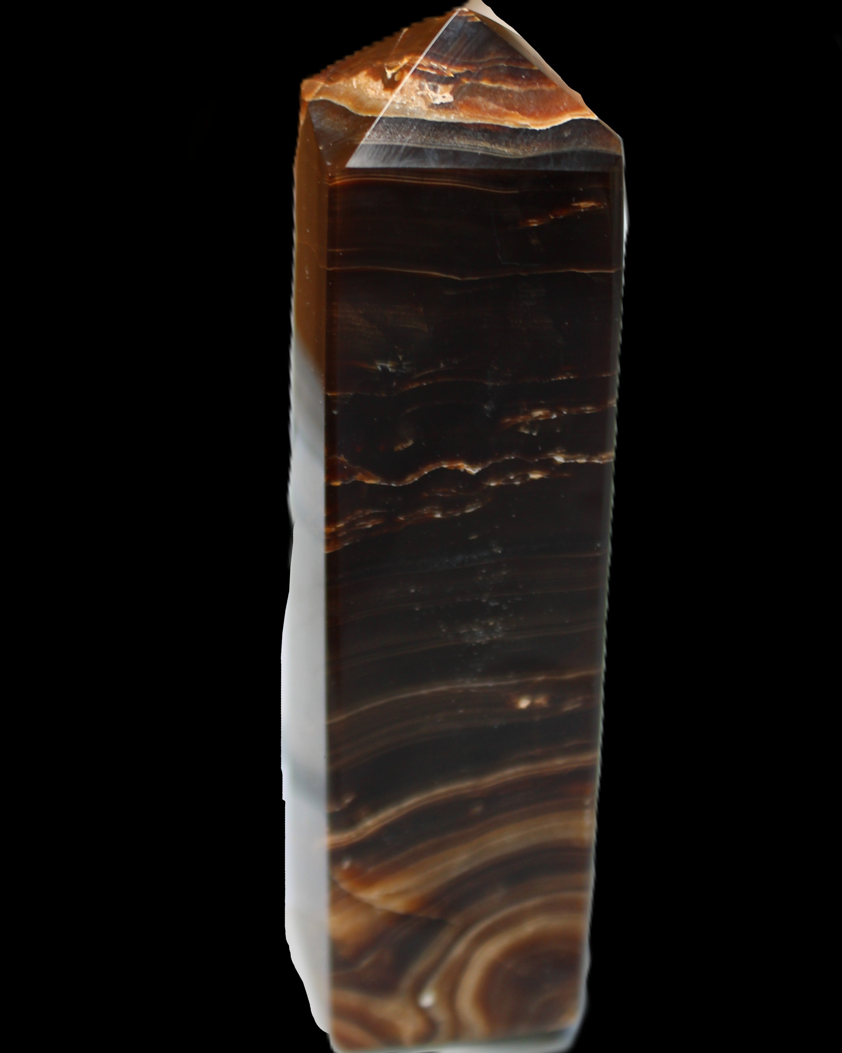 Chocolate Calcite obelisk 136*36mm 366g in sunlight - Rocks and Things Store
