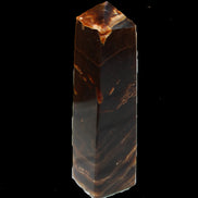 Chocolate Calcite obelisk 136*36mm 366g in sunlight - Rocks and Things Store