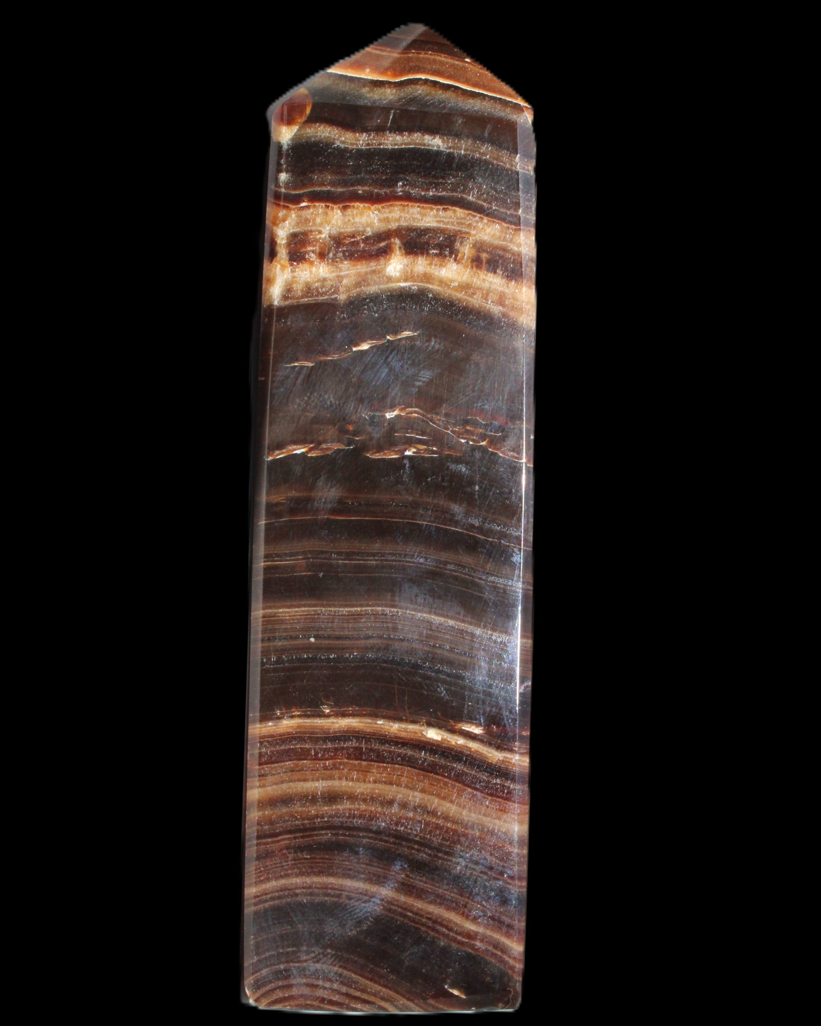 Chocolate Calcite obelisk 122*33mm 270g in sunlight - Rocks and Things Store