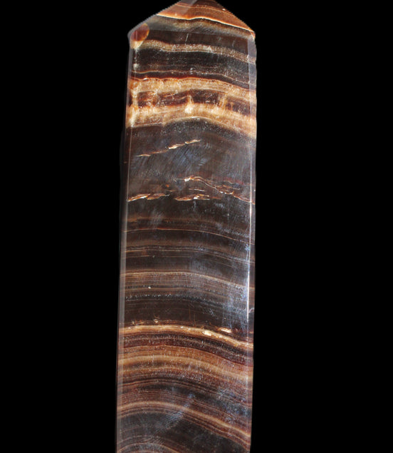 Chocolate Calcite obelisk 122*33mm 270g in sunlight - Rocks and Things Store