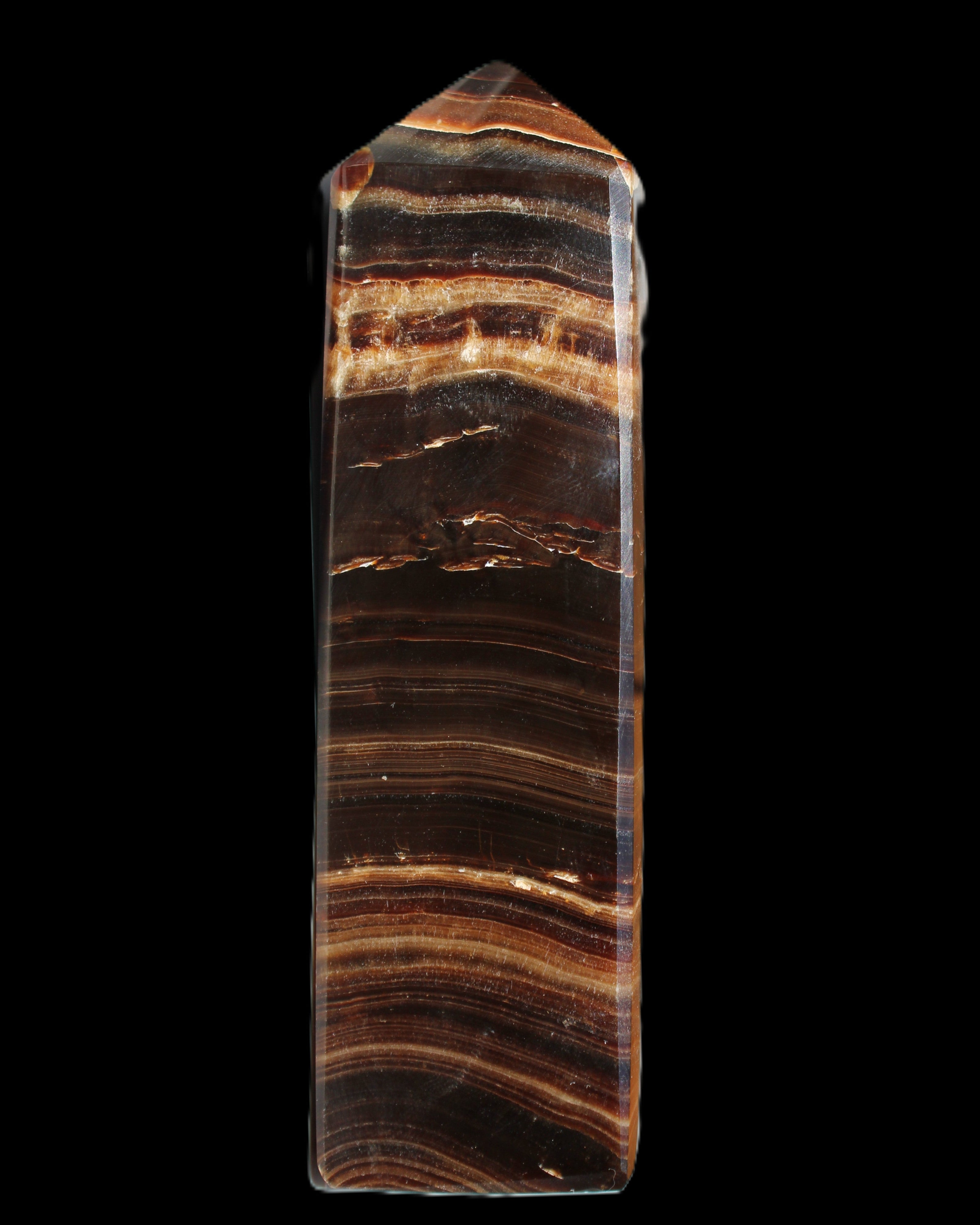 Chocolate Calcite obelisk 122*33mm 270g in sunlight - Rocks and Things Store