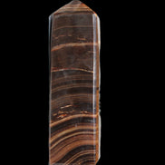 Chocolate Calcite obelisk 122*33mm 270g in sunlight - Rocks and Things Store