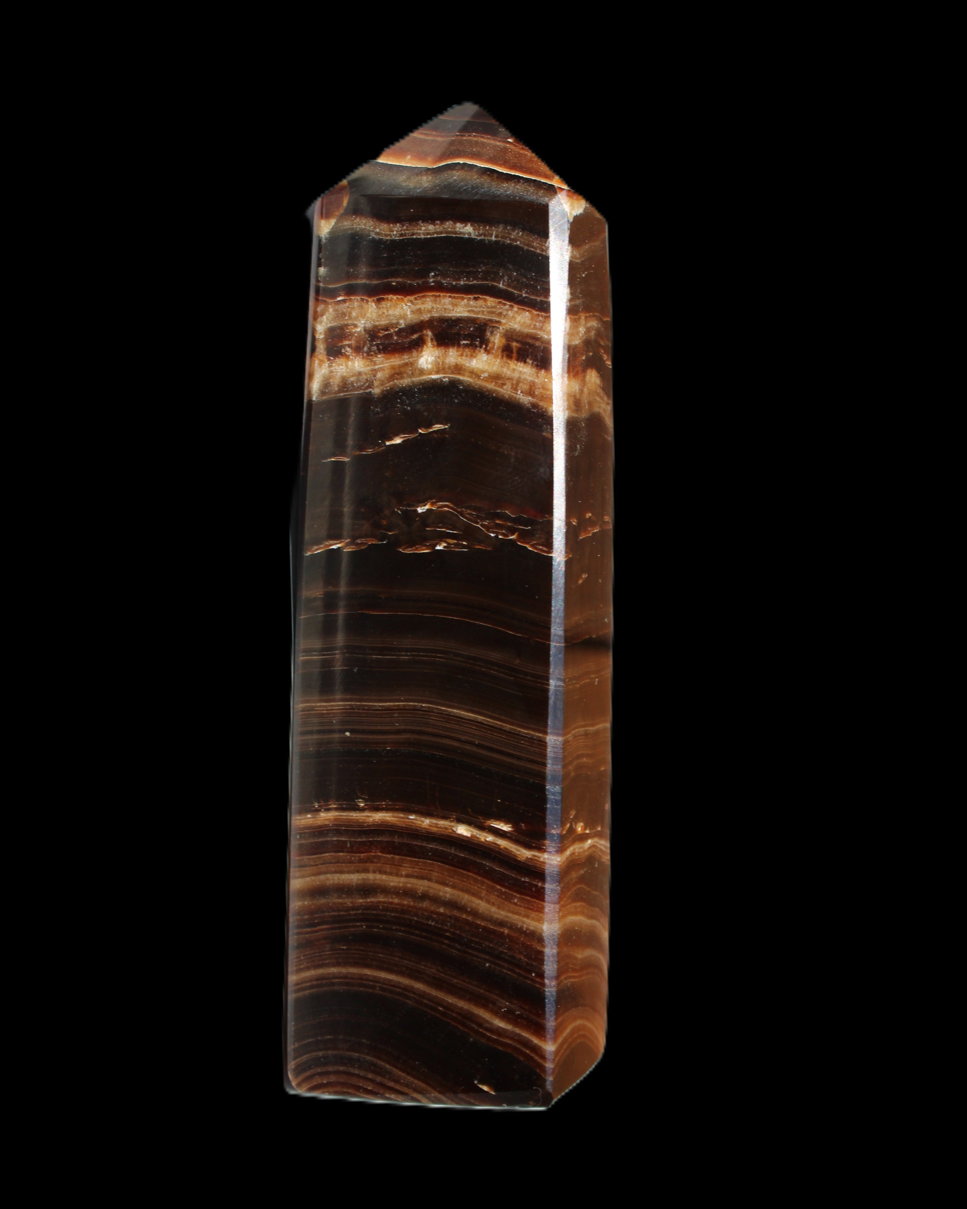 Chocolate Calcite obelisk 122*33mm 270g in sunlight - Rocks and Things Store