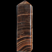 Chocolate Calcite obelisk 122*33mm 270g in sunlight - Rocks and Things Store