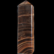 Chocolate Calcite obelisk 122*33mm 270g in sunlight - Rocks and Things Store