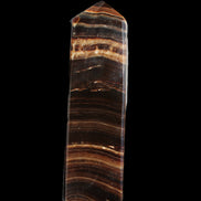 Chocolate Calcite obelisk 122*33mm 270g in sunlight - Rocks and Things Store