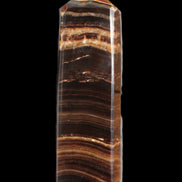 Chocolate Calcite obelisk 122*33mm 270g in sunlight - Rocks and Things Store