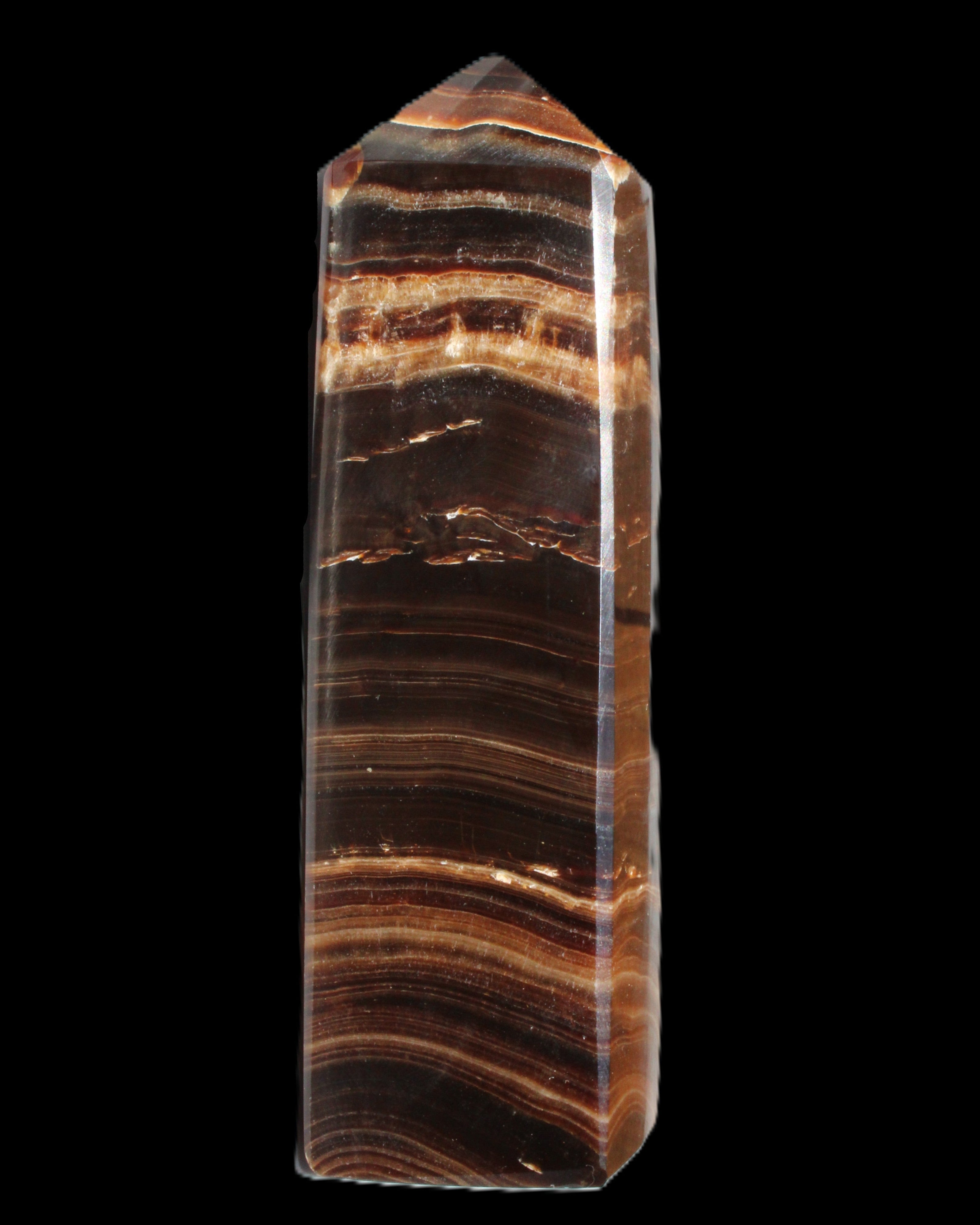Chocolate Calcite obelisk 122*33mm 270g in sunlight - Rocks and Things Store
