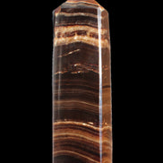 Chocolate Calcite obelisk 122*33mm 270g in sunlight - Rocks and Things Store