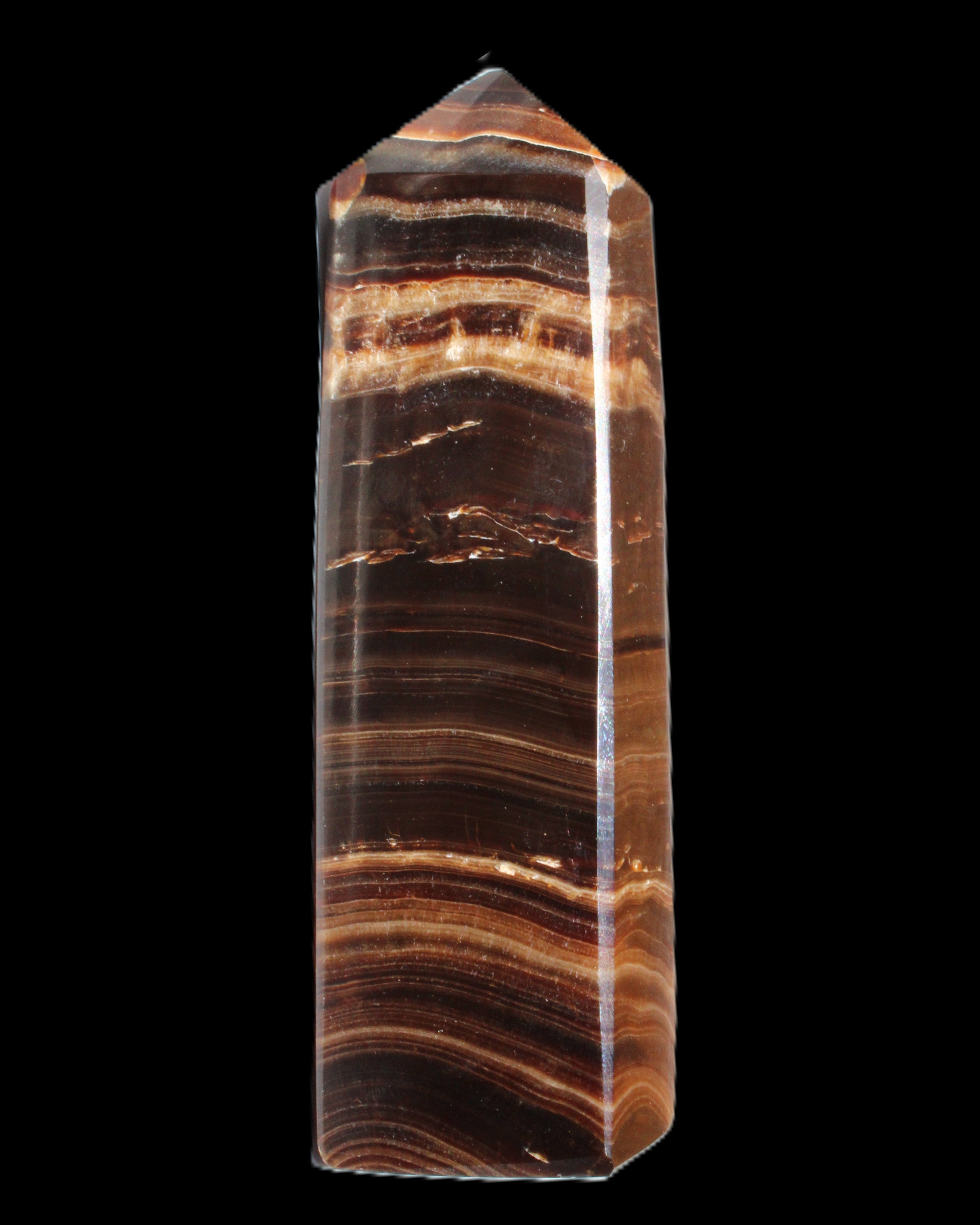 Chocolate Calcite obelisk 122*33mm 270g in sunlight - Rocks and Things Store