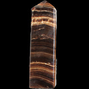 Chocolate Calcite obelisk 122*33mm 270g in sunlight - Rocks and Things Store