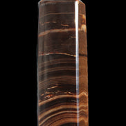 Chocolate Calcite obelisk 122*33mm 270g in sunlight - Rocks and Things Store