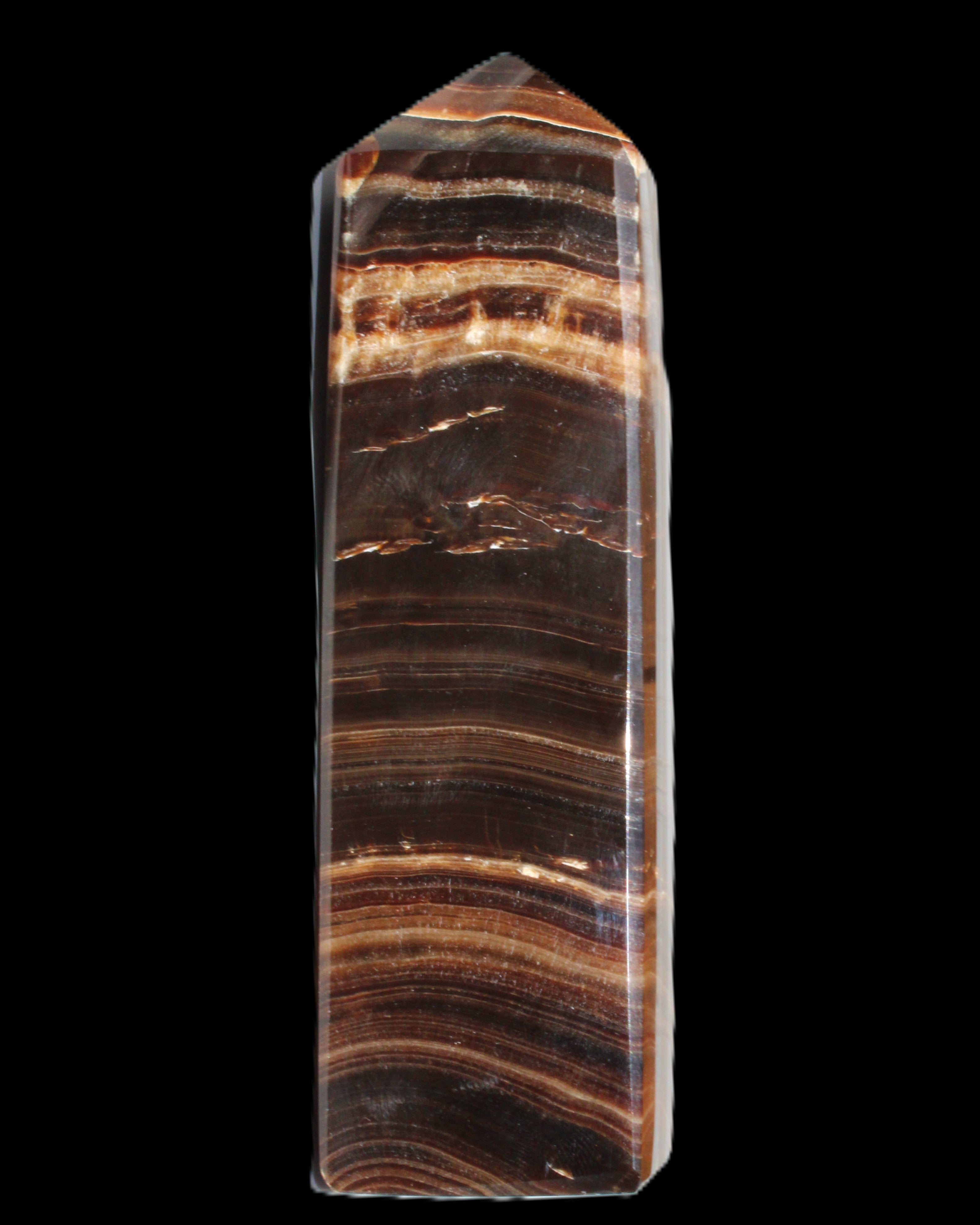 Chocolate Calcite obelisk 122*33mm 270g in sunlight - Rocks and Things Store