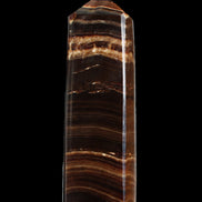Chocolate Calcite obelisk 122*33mm 270g in sunlight - Rocks and Things Store