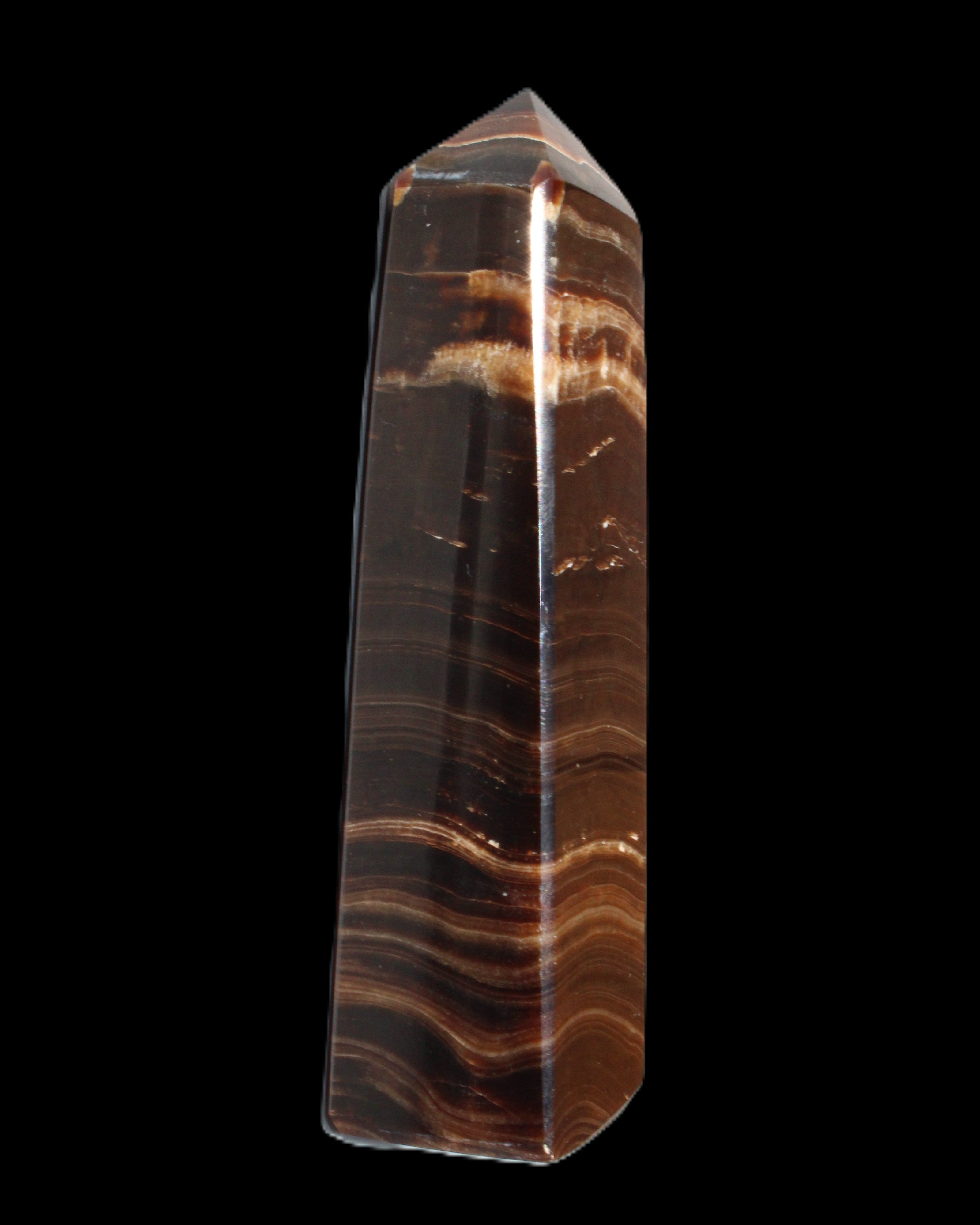 Chocolate Calcite obelisk 122*33mm 270g in sunlight - Rocks and Things Store