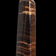 Chocolate Calcite obelisk 122*33mm 270g in sunlight - Rocks and Things Store