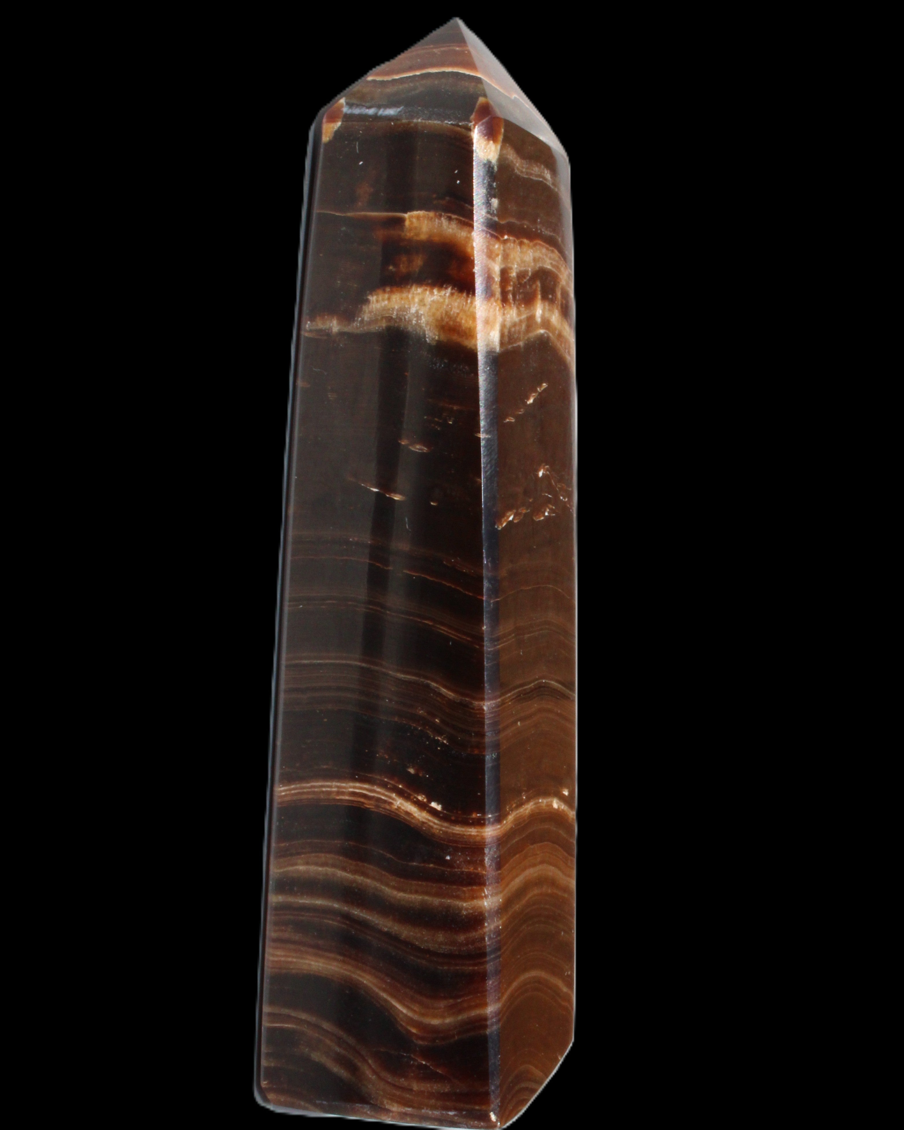 Chocolate Calcite obelisk 122*33mm 270g in sunlight - Rocks and Things Store
