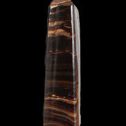 Chocolate Calcite obelisk 122*33mm 270g in sunlight - Rocks and Things Store