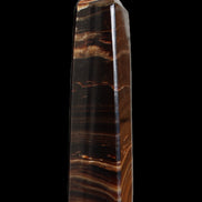 Chocolate Calcite obelisk 122*33mm 270g in sunlight - Rocks and Things Store