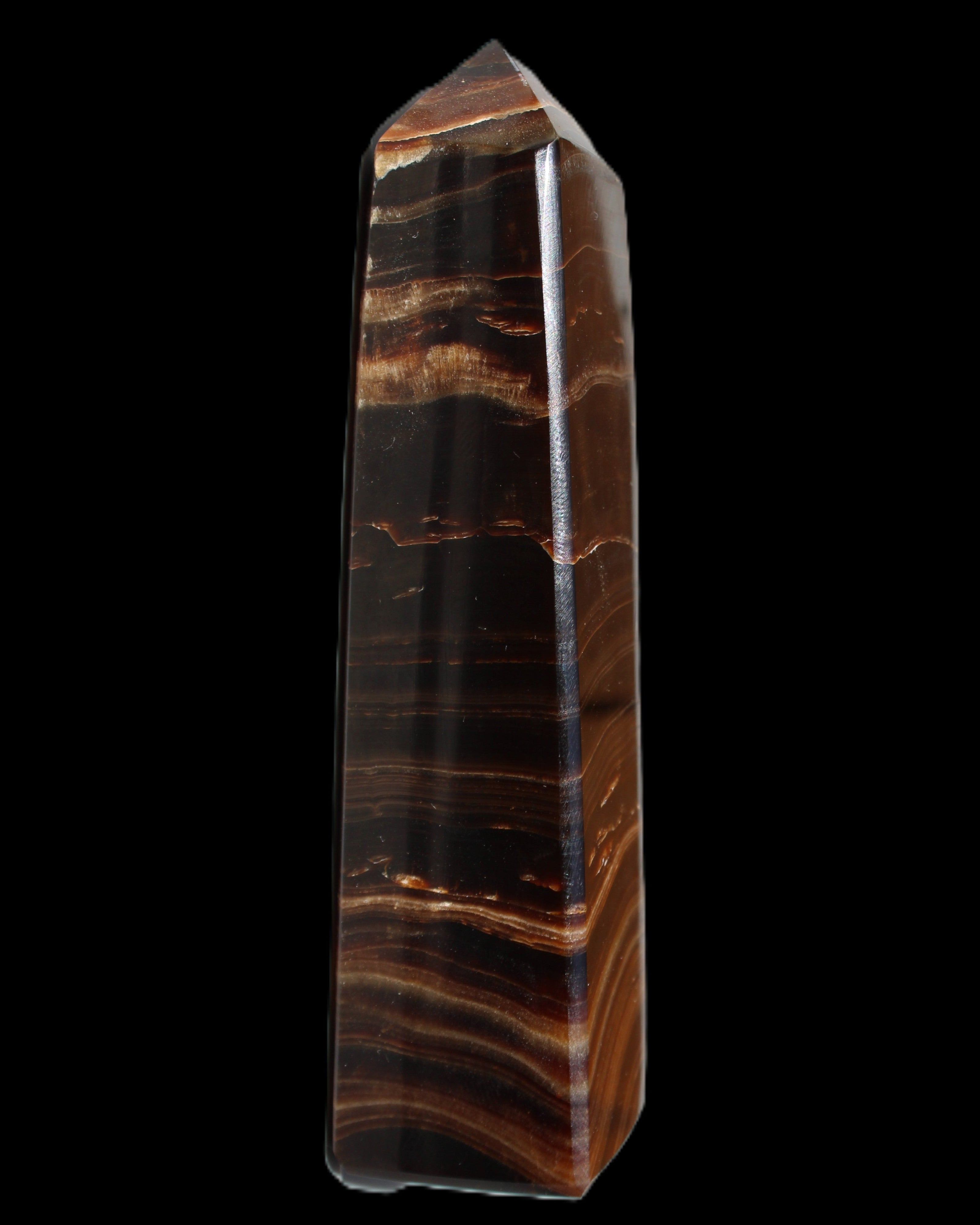 Chocolate Calcite obelisk 122*33mm 270g in sunlight - Rocks and Things Store