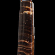 Chocolate Calcite obelisk 122*33mm 270g in sunlight - Rocks and Things Store