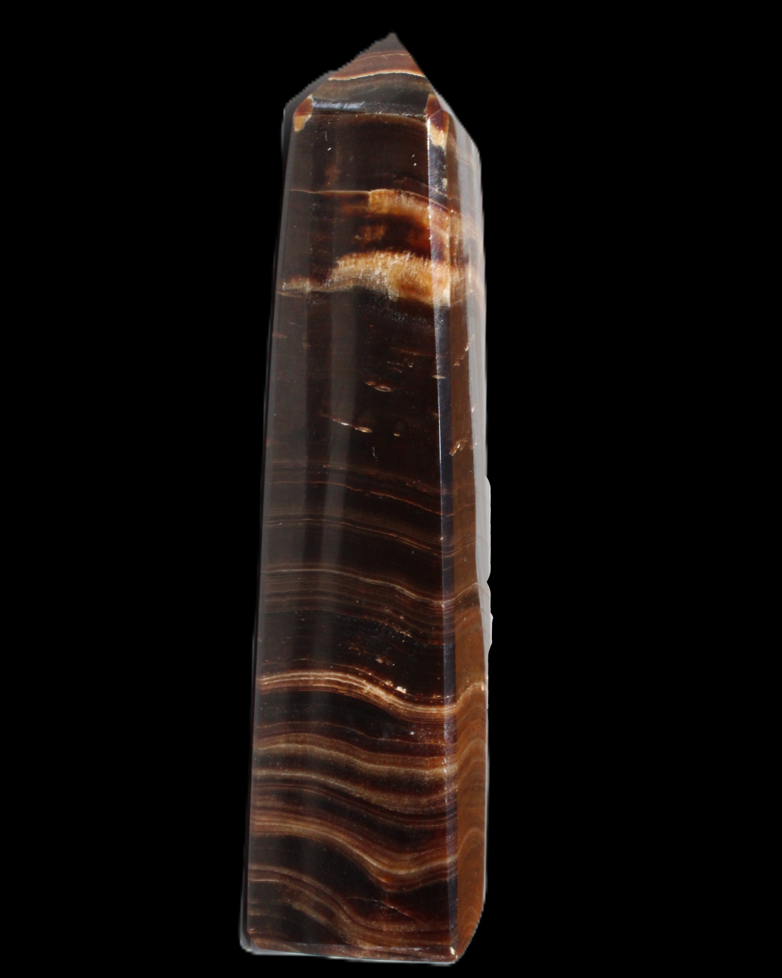 Chocolate Calcite obelisk 122*33mm 270g in sunlight - Rocks and Things Store