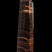 Chocolate Calcite obelisk 122*33mm 270g in sunlight - Rocks and Things Store